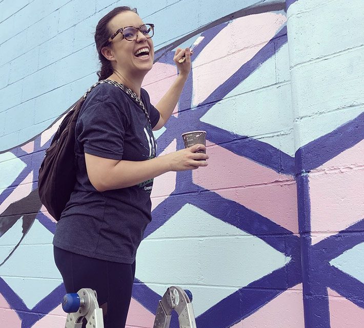 Lady Laughing While Doing Charity Work