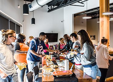 Investinet Employees sharing a meal